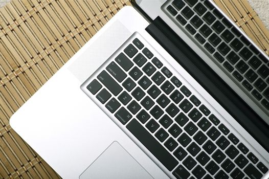Modern Silver Notebook - Laptop / Top View Photo. Silver Body and Black Keyboard. Technology Photo Collection. Horizontal Photo
