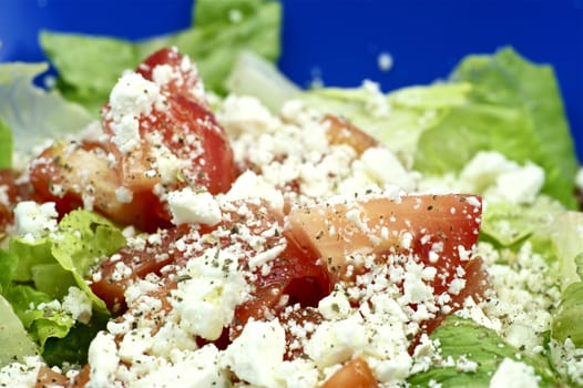 Spring Salad with Greens, Tomatoes and Feta Cheese. Tasty Appetizer