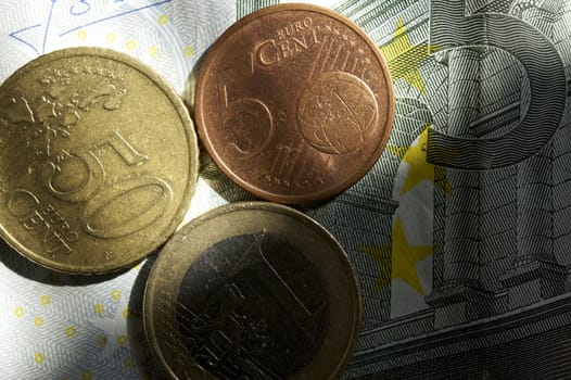 Euro Money New Light - New Day for European Union Currency. Euro Coins on Euro Bill Business Photo Theme.