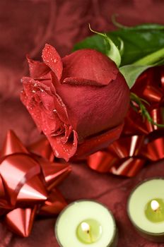 The Red Rose. Fresh Cut Red Rose and Small Green Candles.