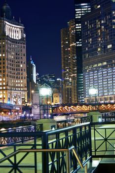 Chicago Colorful Night at River Walk. Chicago by Night. Vertical Photography of Riverwalk and Chicago Downtown Skyscrapers. 