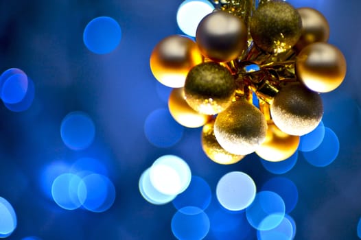 Golden Christmas Ornaments - Blue Light Bokeh Background. Christmas Photo Collection.