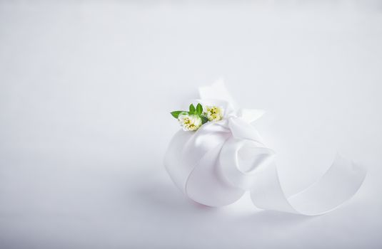 Egg with flowers on a white background. Easter Symbols.