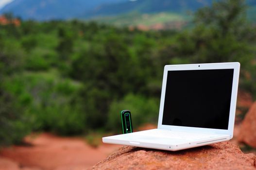 Broadband Internet. Outdoor Internet Surfing. Laptop on the Rock.