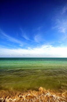 Caribbean Ocean. Clear Warm Caribbean Waters. Mostly Clear Dark Blue Caribbean Sky. Vertical Photography