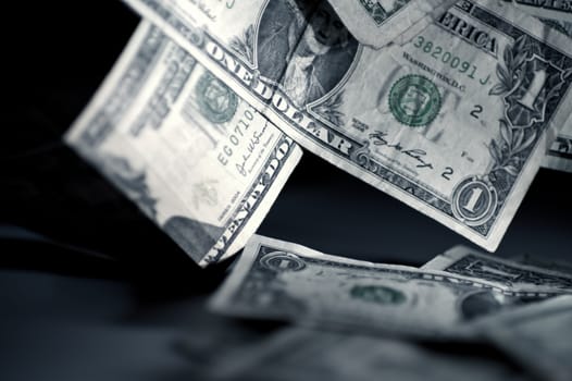 Falling American Money. One Dollar Bills Falling on Table. Dark, Closeup Photography