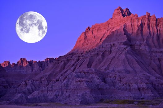 Full Moon in the Badlands National Park, South Dakota, USA. Eroded Moon-Like Sandstones Landscape. 
