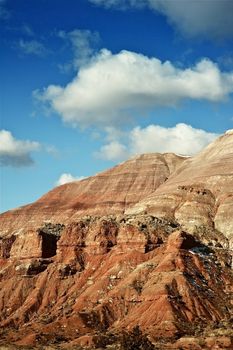 Rocky Utah Landscape and Blue Cloudy Sky. Vertical Photo. Utah Rocks Formation. Utah, USA