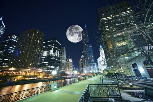 Chicago USA. Chicago at Night. Shot Taken from Chicago Famous Riverwalk. Large Moon on the Sky.