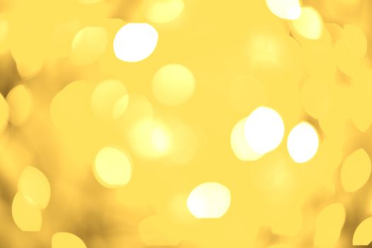 Golden Lights Bokeh Background. Out of Focus Golden Lights. Cool Golden Bokeh Background.Perfect for Christmas Related Artwork. Holidays Photo Collection.