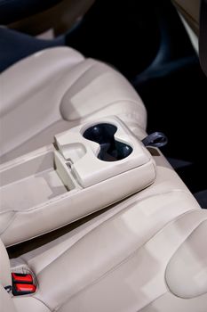 Car Back Seats with Drink Holders in a Middle of Seat. Nice Leather Vehicle Seats. Transportation Photo Collection.
