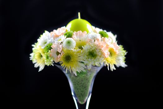 Flowers Bouquet with Green Candle. Part of Wedding Tables Decoration. Horizontal Studio Photo.