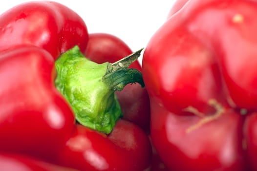 Red Paprika Fruits Closeup Photo. Red Paprikas Isolated on White Background.