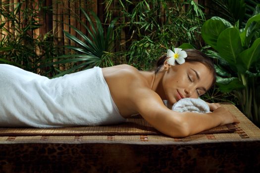 portrait of young beautiful woman in spa environment.