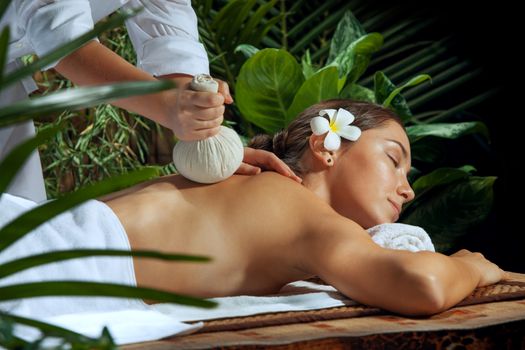 portrait of young beautiful woman in spa environment