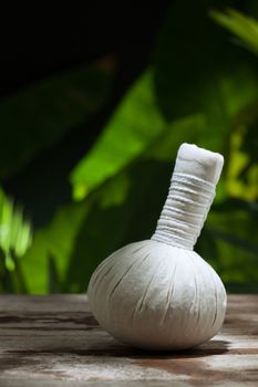 close up view of  white Herbal Compress on color back.
