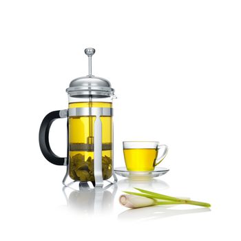 close up view of french press and a cup of green tea wuth lemongrass on white background