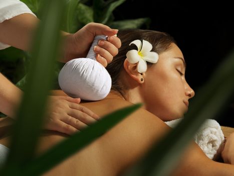 portrait of young beautiful woman in spa environment