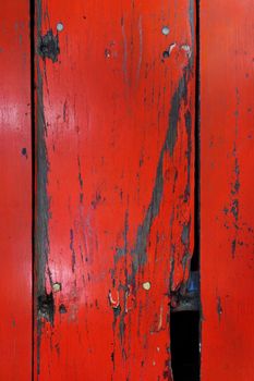 Old wood board painted red, background texture                               