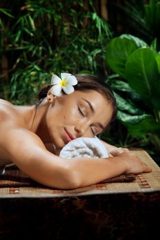 portrait of young beautiful woman in spa environment.