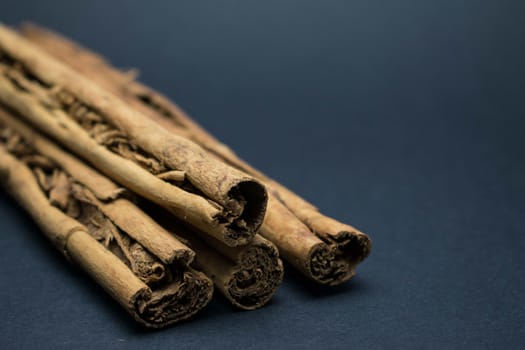 Sticks of cinnamon on a dark background