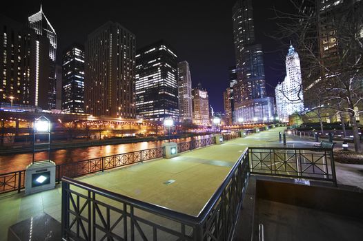 Riverwalk Downtown Chicago, Illinois USA. Super Wide Angle NIght Time Photography of Chicago River, Riverwalk and Skyscrapers.
