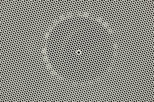 Mesh Metal Body Background. Small Circle Holes Pattern. Photo Background.