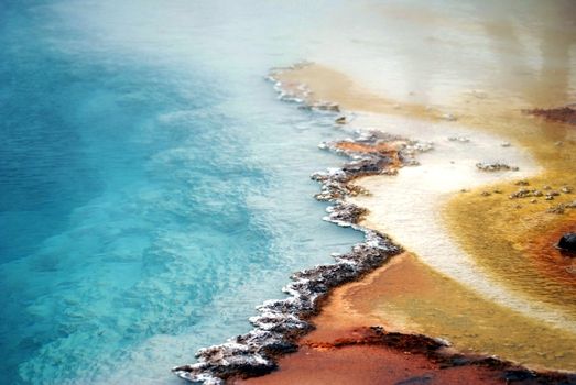 American National Parks: Yellowstone Geyser, Crystal Clear Toxic Water of Geyser. Wyoming, USA