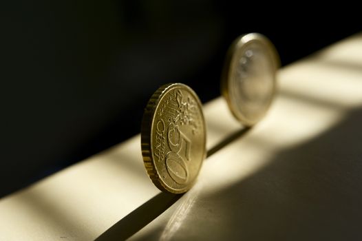 Rolling Euro Money - Rolling Euro Coins in the Sunlight. European Union Business Theme. Horizontal Photography