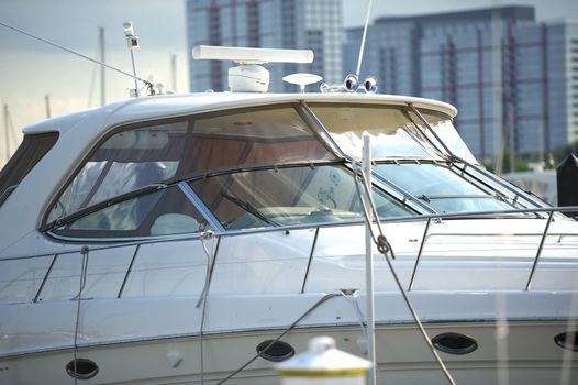 Luxury Boat Docked in City Harbor. Horizontal Photo - Boat Closeout.