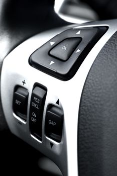 Driving Wheel Sound System and Navigation Buttons. Modern Vehicle Technology and Design. Car Interiors Photo Collection