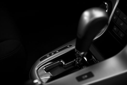 Automatic Transmission Control in Modern Vehicle. Black and White Dark Studio Photo.