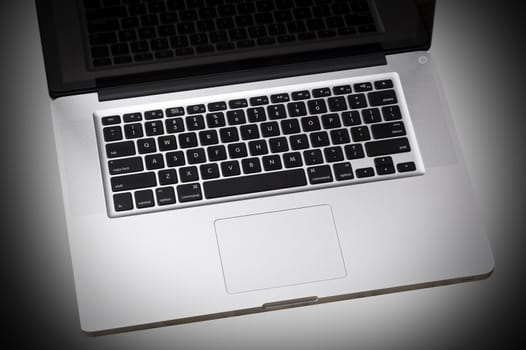 Laptop Keyboard - Grayscale Central Light Spot Background. Technology Photo Collection.