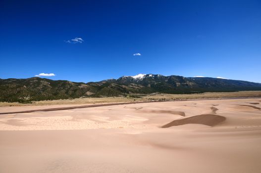 Dunes and Mountains. Great Sand Dunes National Park Colorado USA and Rocky Mountains