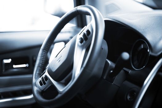 Steering Wheel with Navigation and Sound System Operating Buttons. Car Interior.