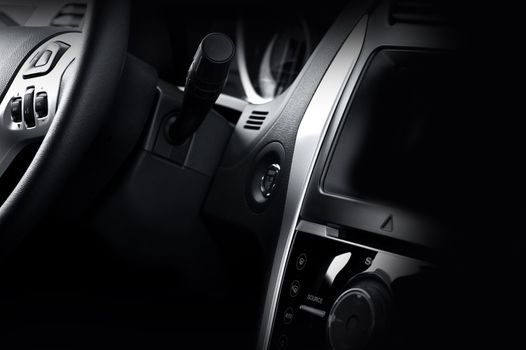 Modern Vehicle Dash and Steering Wheel. Dark Vehicle Interior. Modern Design.