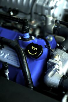Vehicle Engine with Blue Block Elements and Oil Icon. This is Performance Tuned Vehicle Engine.