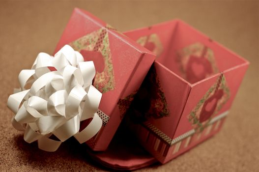 Open Gift Box. Opened Gift Bow with White Bow on the Top. Small Gift Box.