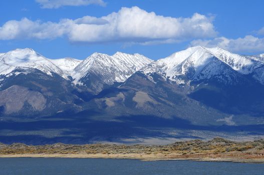 San Luis Lake and snowy Rocky Mountains - Colorado USA