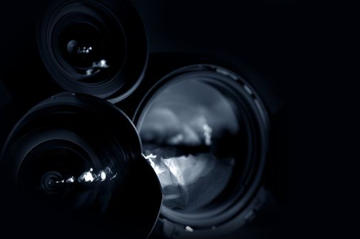 Professional Photography Lenses in the Dark. Horizontal Studio Photo.