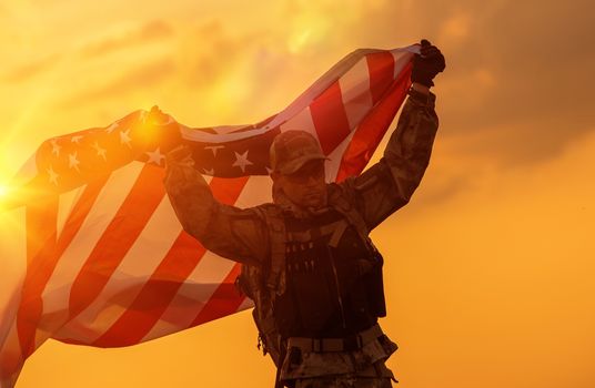 Soldier Celebrating Victory Running with Large American Flag. Trooper with the Flag.