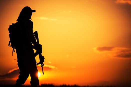 Call of Duty. Military Concept with Soldier with Assault Rifle on Duty During Sunset.