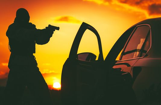 Counter Terrorism Check Point. Hunt For Terrorists. SWAT member in a Mask Pointing His Gun on Terrorist Member Inside Stopped Vehicle. 