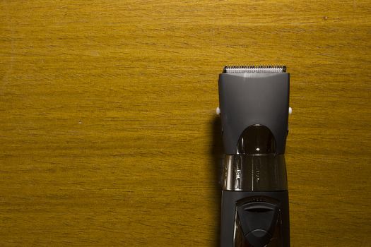 Hair clipper style on the wooden background