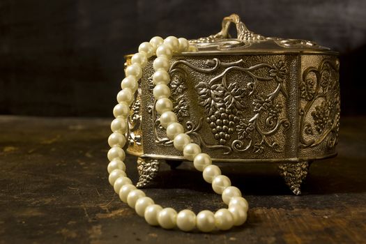 Vintage jewelry box on a wooden table