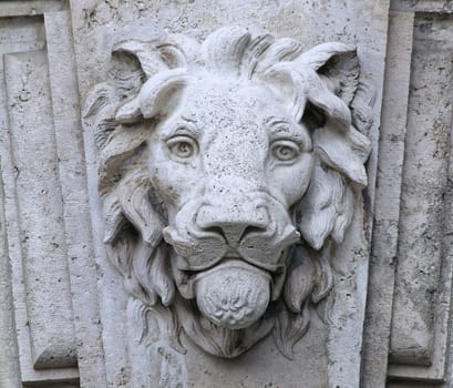 Castle building is decorated with carved stone face.