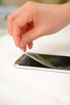 Applying screen protector on smartphone