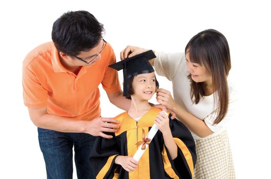 Asian kid in graduation gown.Taking photo with family.