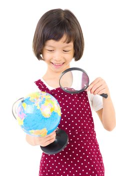 Asian little girl looking at the globe