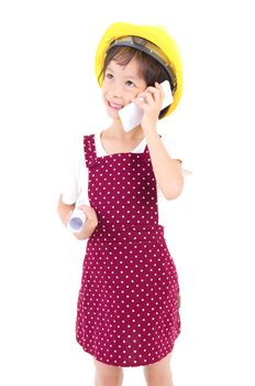 Little Engineer wearing the construction helmet,talking with smartphone and  olding a contruction drawing, isolated over white background.